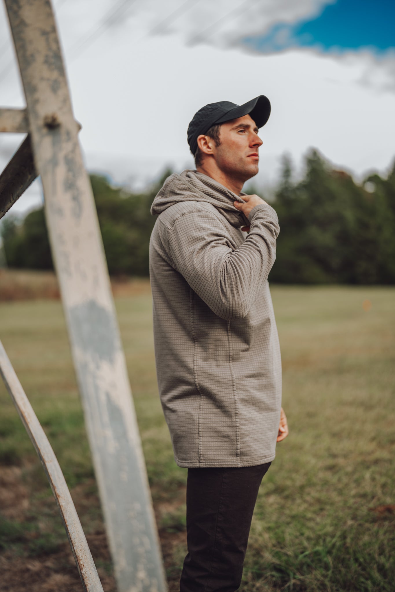 Standing in the field in the Waffle Hoodie, Stone Taupe