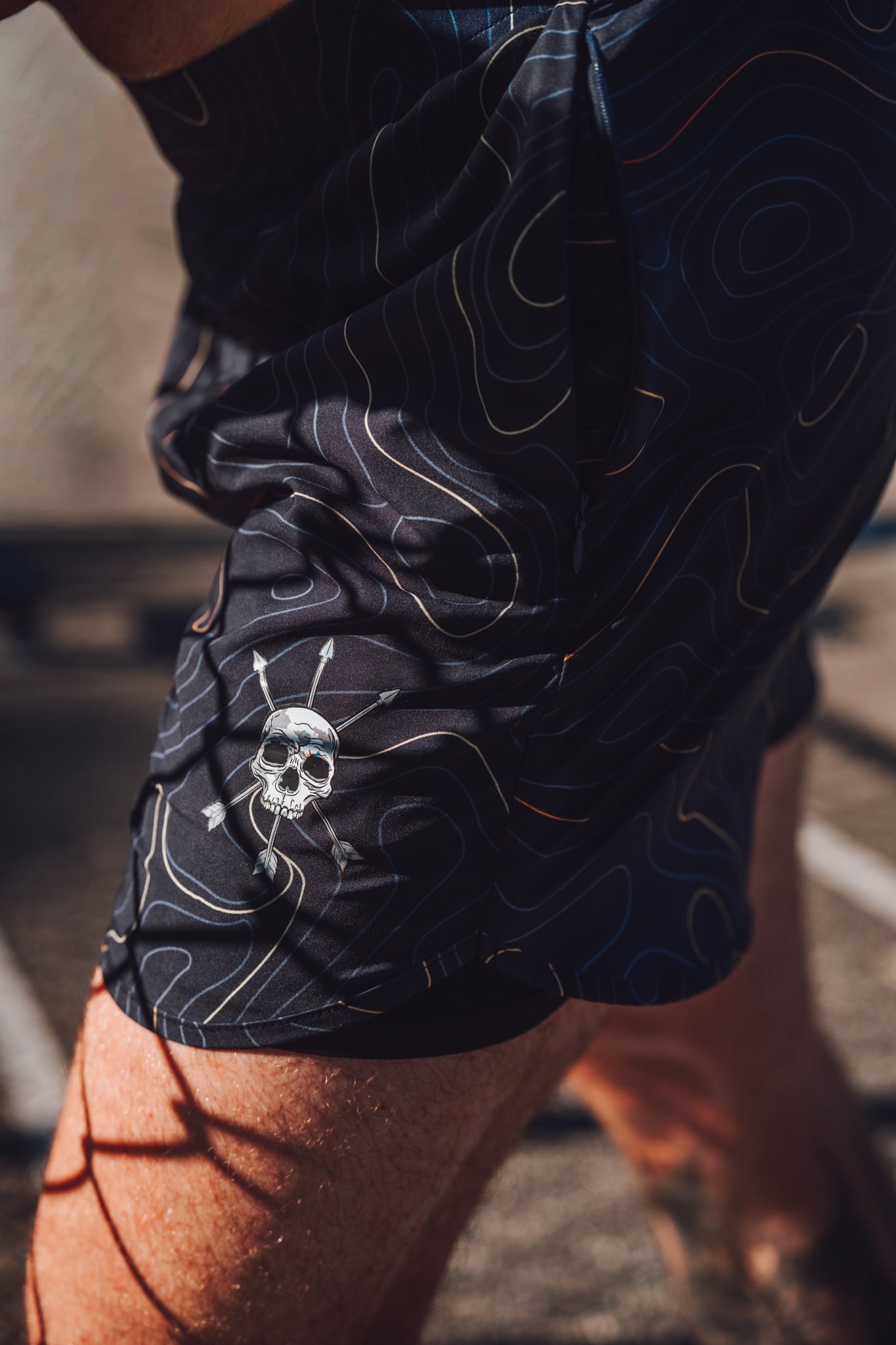 Skull and arrows mark beside the zip