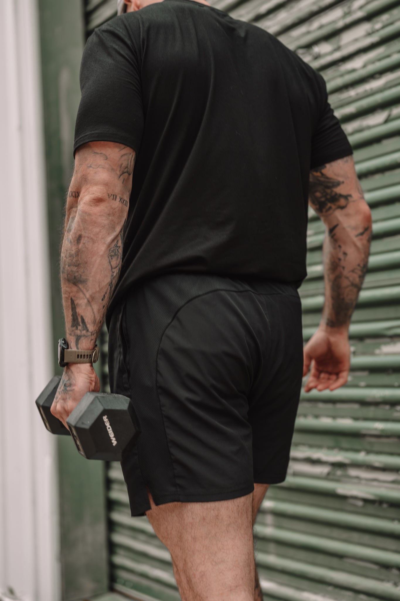 Clean back panel carrying a dumbbell