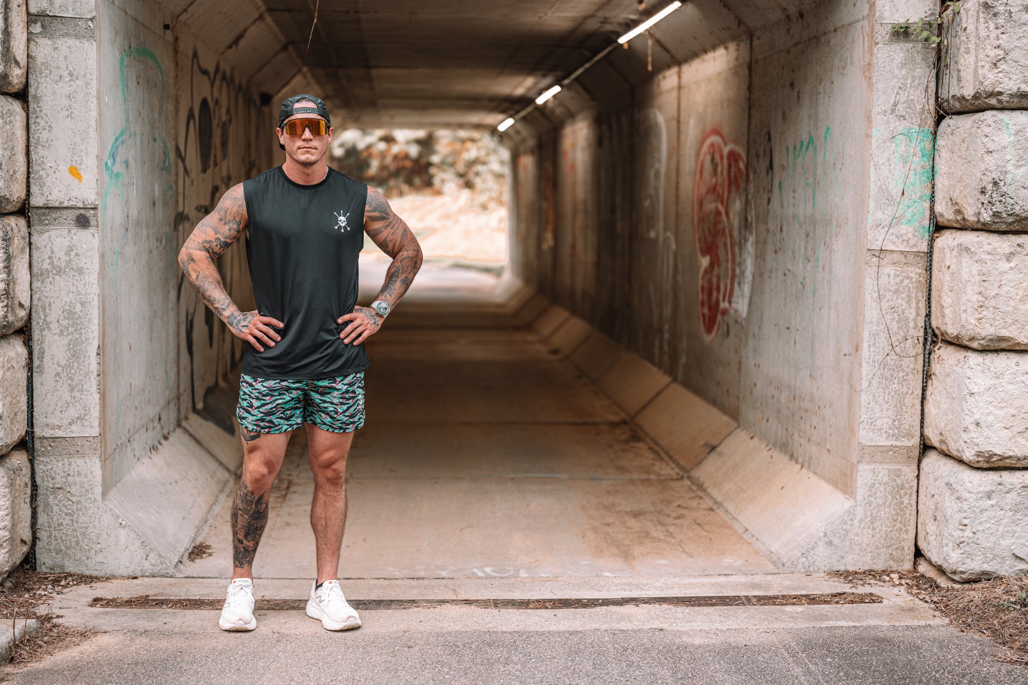 Miami Vibez Hybrid Short standing in the tunnel mouth