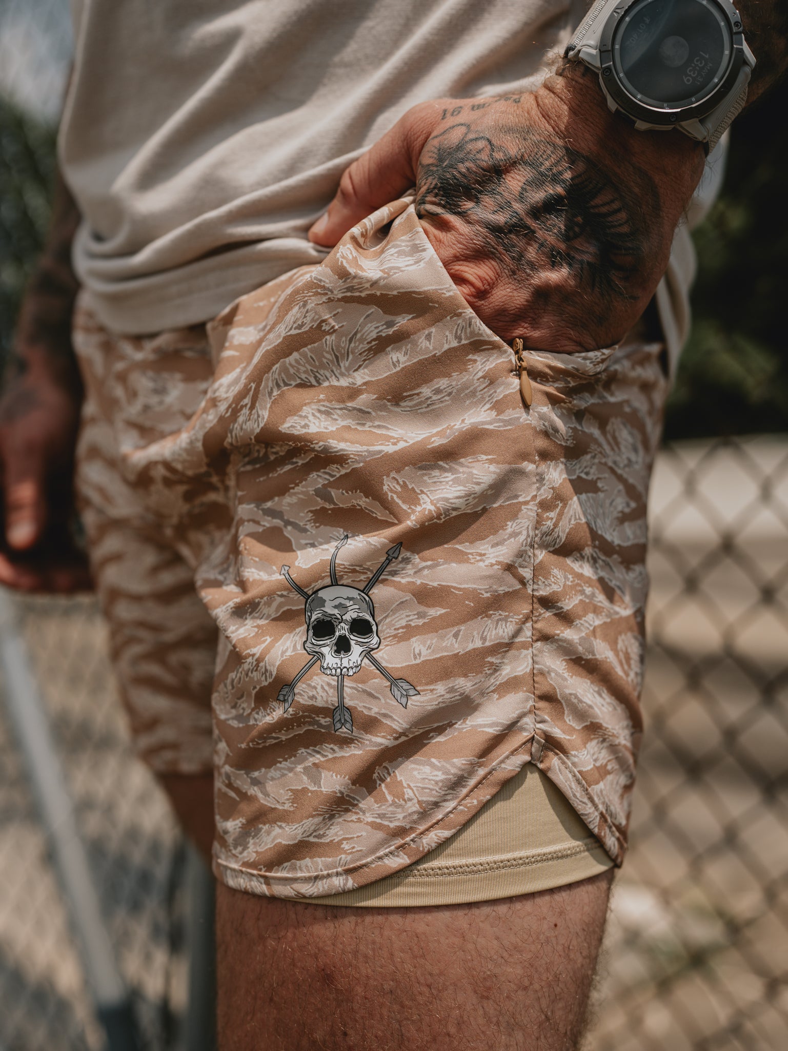 Skull and crossed arrows mark on the tigerstripe face fabric