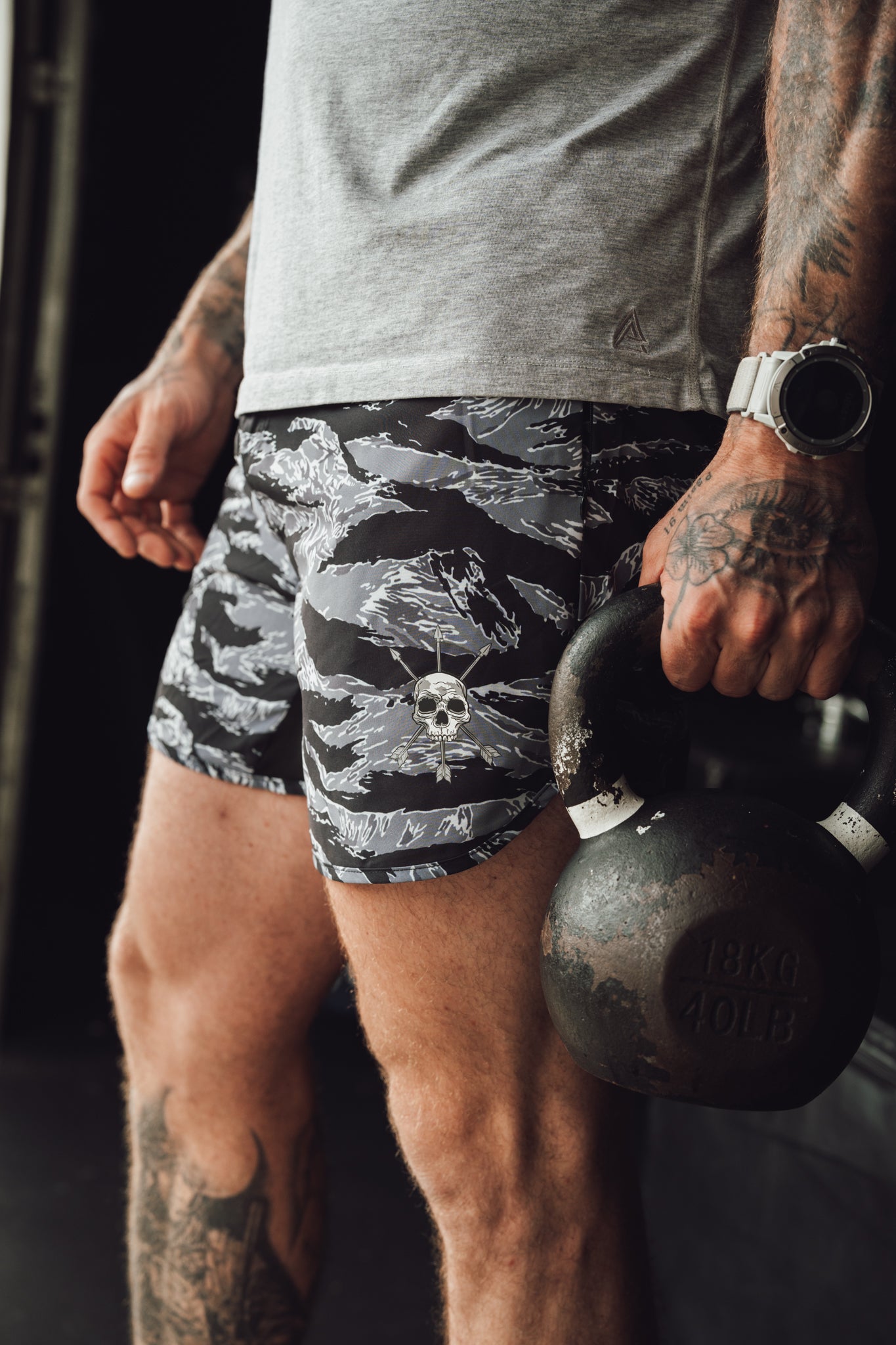 The mark on the Stealth Short carrying a kettlebell