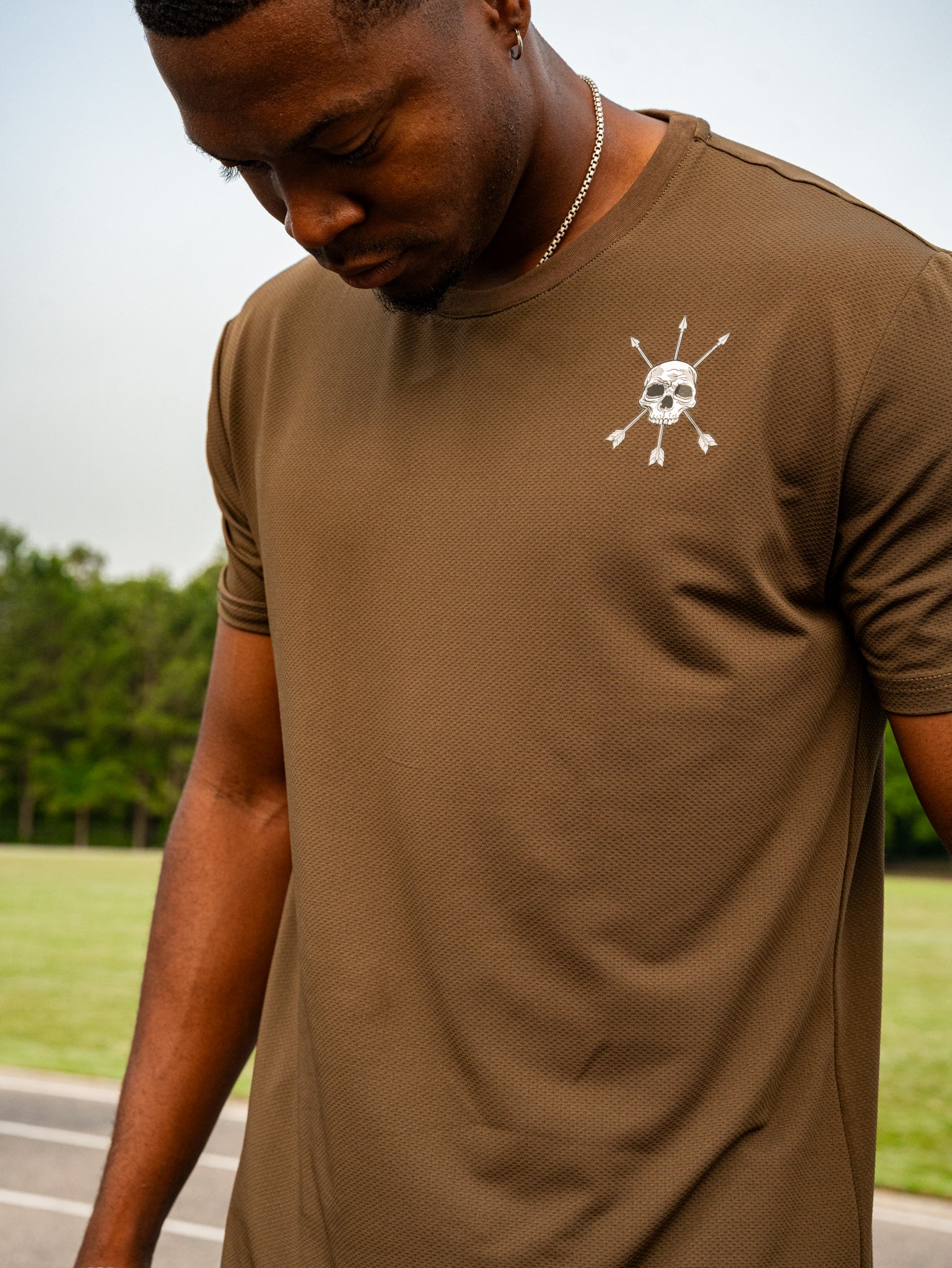 The skull and arrows mark on the Ascend Tee