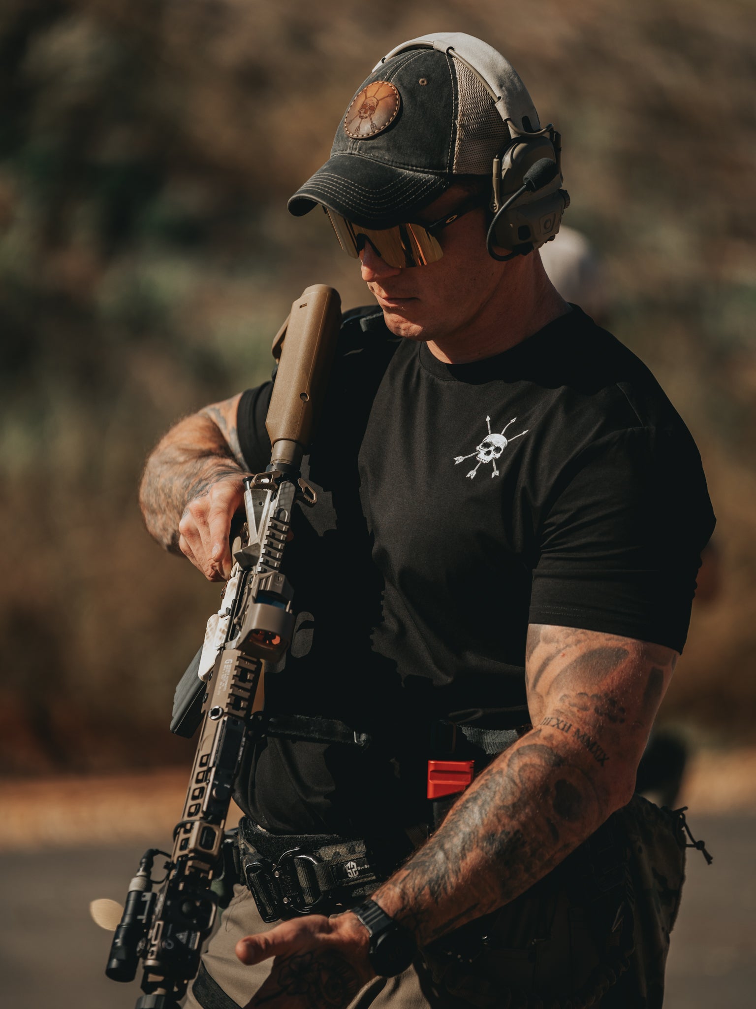 Working the rifle in the Raider Tee