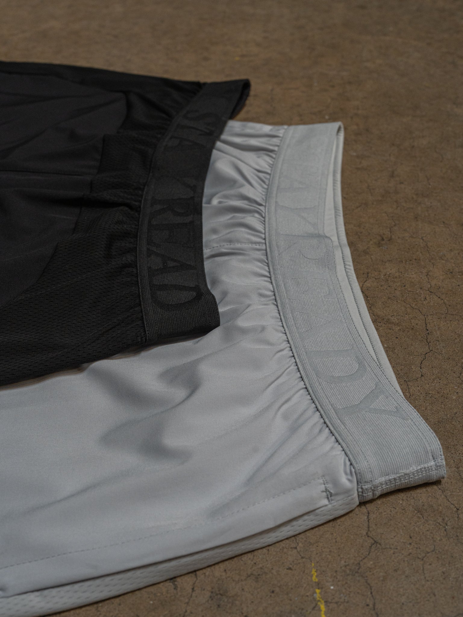 Lunar Rock and Black waistbands side by side