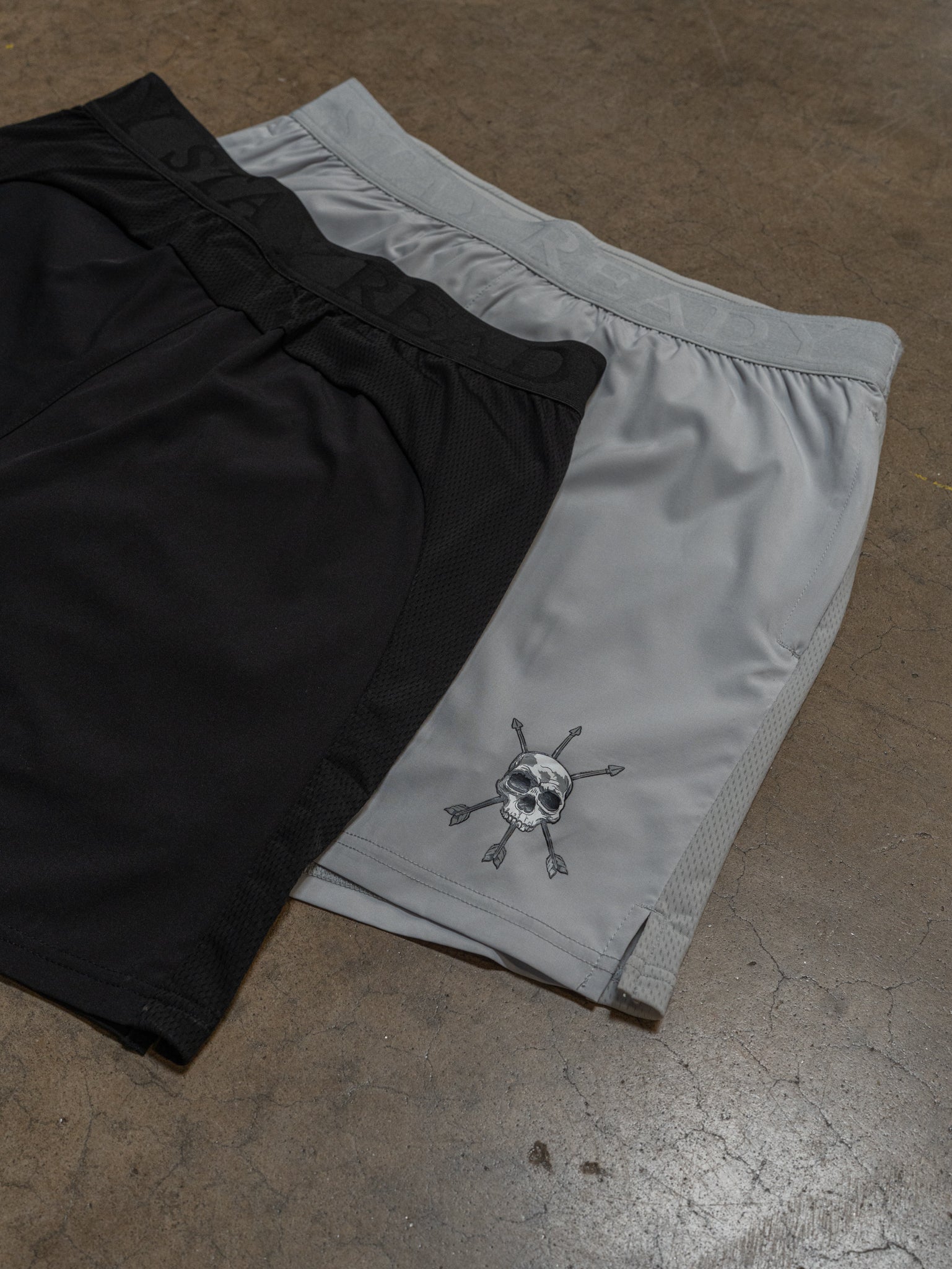 The mark on the Lunar Rock Motto Short laid next to the black pair
