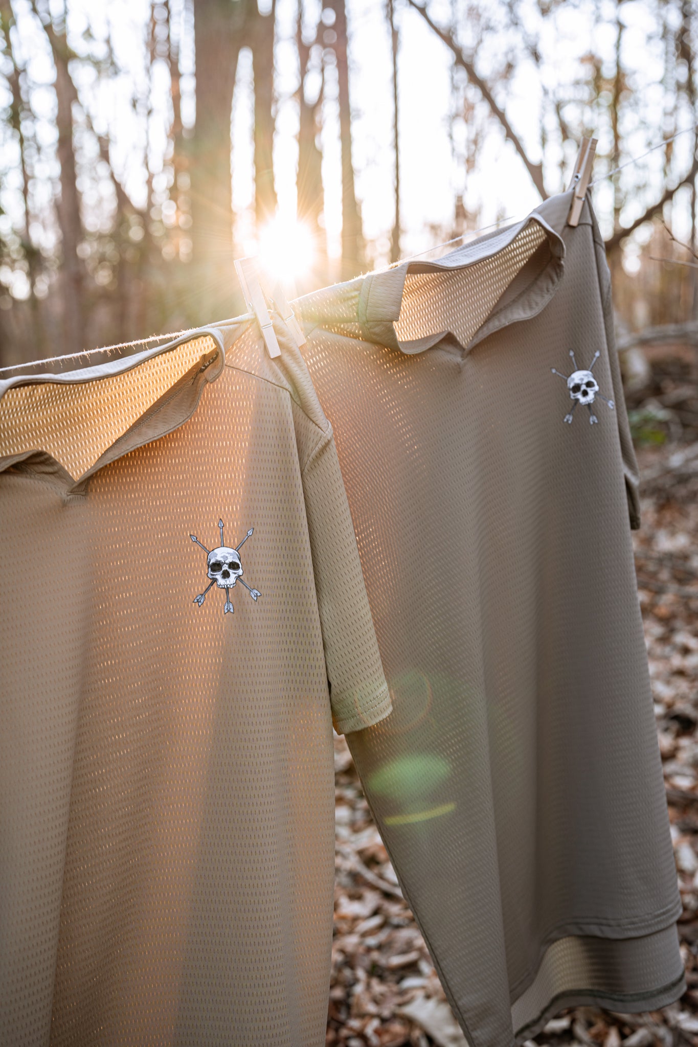 Two Ultra X Tees on the line with the sun behind them