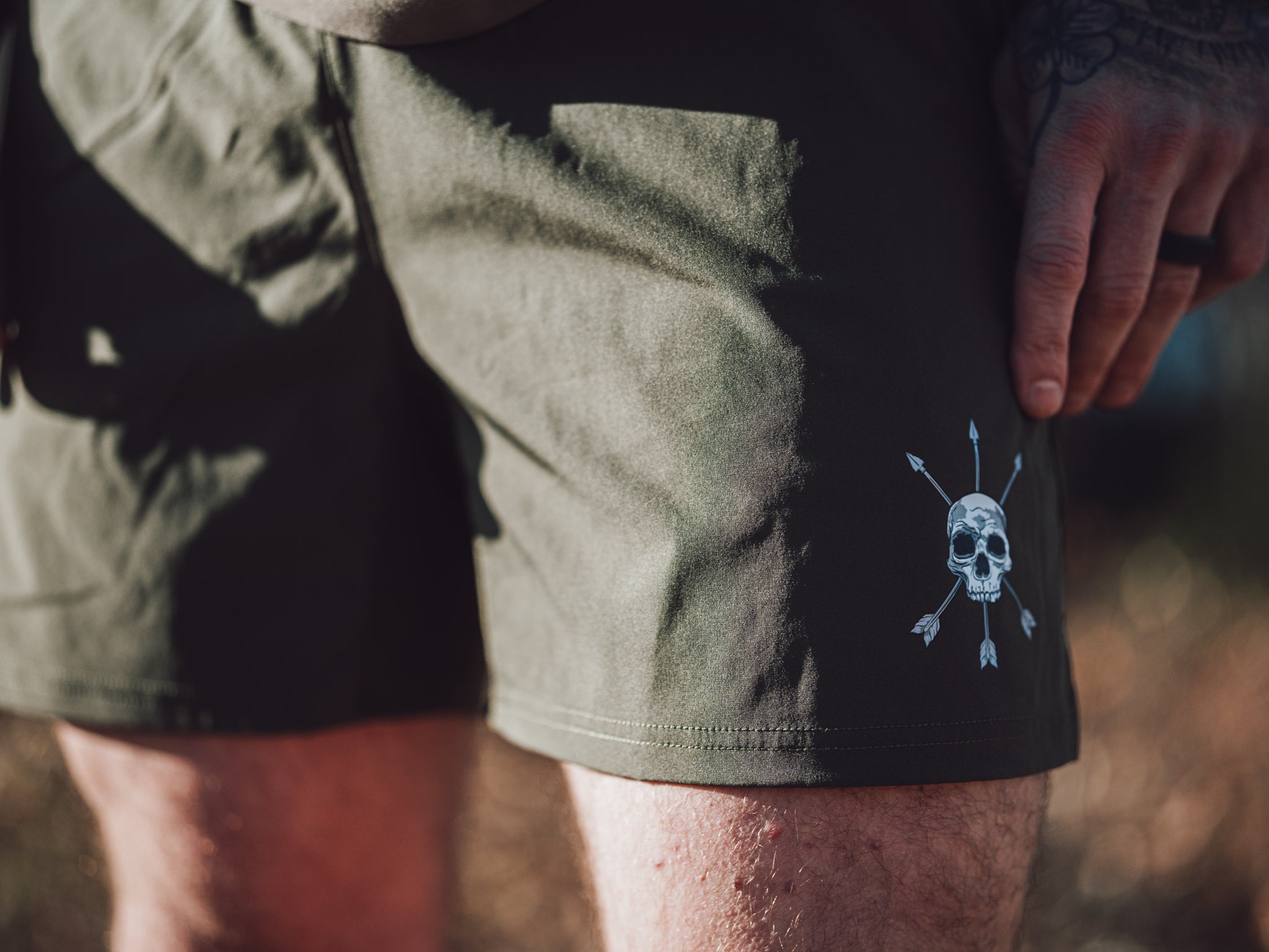 Skull and crossed arrows mark low on the left leg